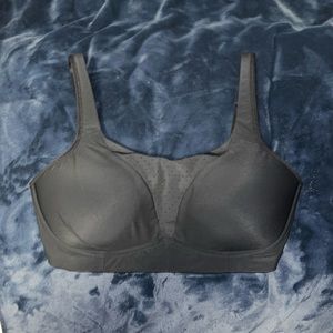 Black high support Lululemon bra with straps that can be straight or crossed.